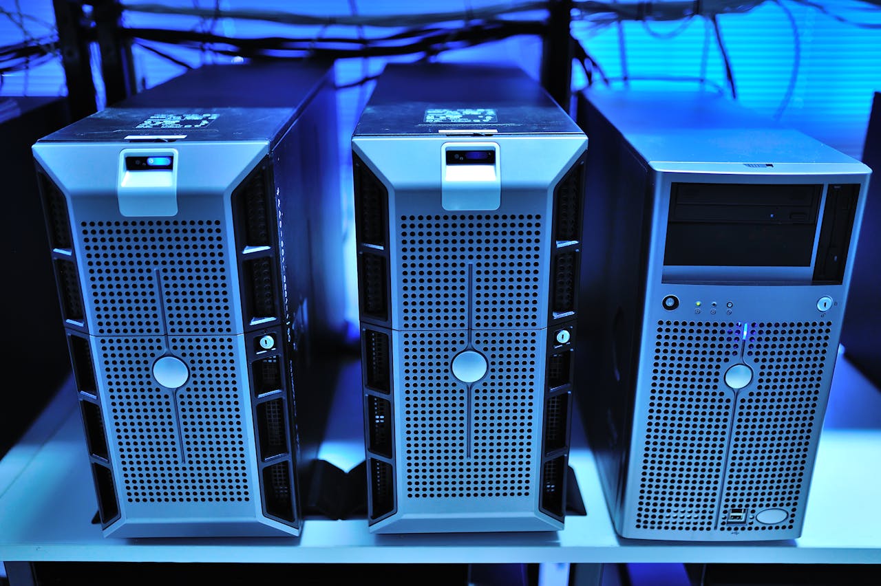 Features Close-up view of modern rack-mounted server units in a data center.